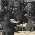 Photograph: People receive donations of milk and food courtesy of Dr. Charles A. Beard