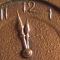 Medallion: A commemorative medallion issued in 1930. The back side features a clock with hands frozen at two minutes to noon.